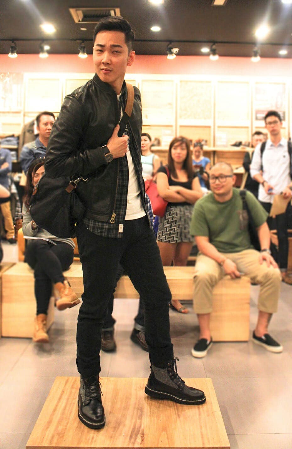 The perfect use of black leather, monochromatic plaid & tweed.